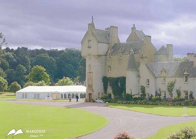 Image of grand country estate with luxury wedding marquee in background