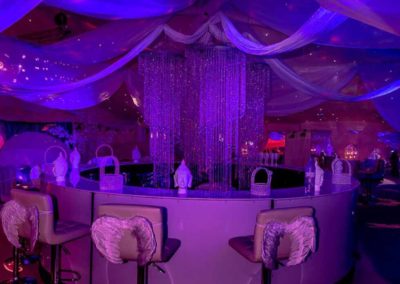 Luxury 'Heaven' marquee with glamorous circular bar and angel chairs