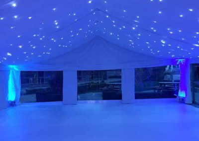 Marquee with flat ivory walls, starlight lighting in blue