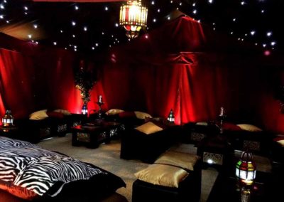 Image of luxury interior of festival marquee in red black and gold scheme