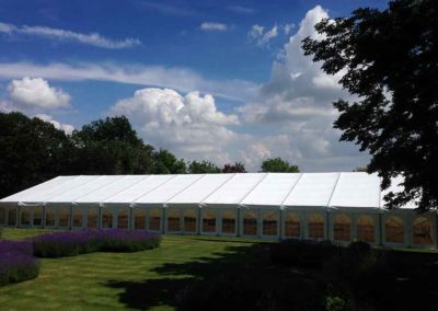15m wide marquee with clearspan Georgian style windows set in a lovely garden setting
