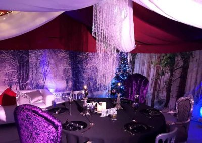 Christmas marquee, beaded lights, grand chairs, winter scene backdrop walls