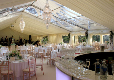 Image of ivory cone roof, walls and swagged curtains open to garden