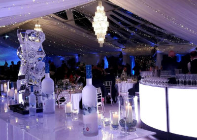 Inside wedding marquee showing vodka bar in foreground